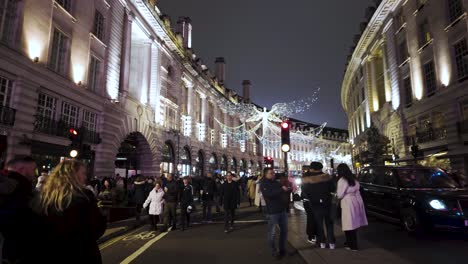 POV-Walking-Along-Closed-Regent-Street-With-Spirit-Of-Christmas-Angel-Lights-On-Display
