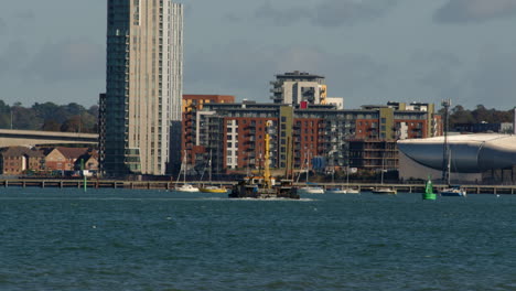 short-of-a-working-tugboat-on-the-Solent-in-Southampton-with-weston-in-background