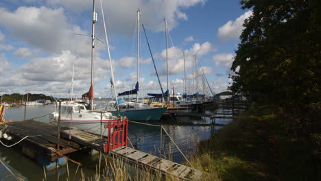 sailboats-moored-up-at-high-tide-at-Ashlett-creek-sailing-club-in-the-Solent,-Southampton