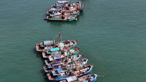 Aerial-top-down-of-Vietnamese-big-trawlers-and-fisherman-boats-,squid-fishing-boats
