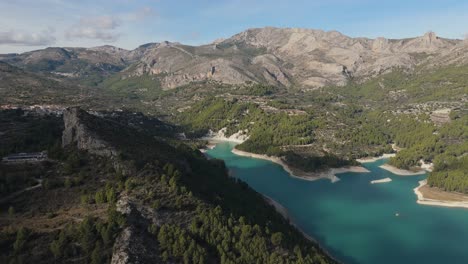 A-blue-lake-drone-view-surrounded-by-mountains