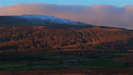 Aerial-Drone-Shot-of-Snow-Capped-Whernside-at-Golden-Hour-Sunset-in-Yorkshire-Dales-UK