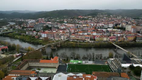 Aerial-pan-across-Ourense-and-Rio-Mino-with-many-iconic-bridges-on-overcast-day