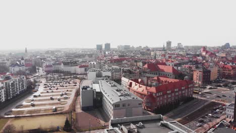 Panoramic-aerial-establishing-overview-of-Poznan-City,-Poland-at-midday