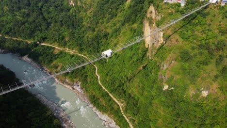 Person-bungee-jumps-off-Kushma-suspension-bridge-in-Nepal