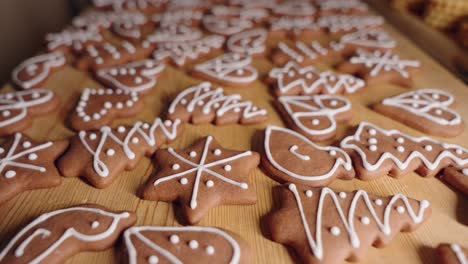 Decorating-Gingerbread-Cookies-for-Christmas,-Closeup-Macro-Shot-Making-handmade-festive-new-year-sweets-and-cookies-with-white-glaze-icing
