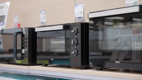 Microwave-oven-on-a-shelf-in-a-store