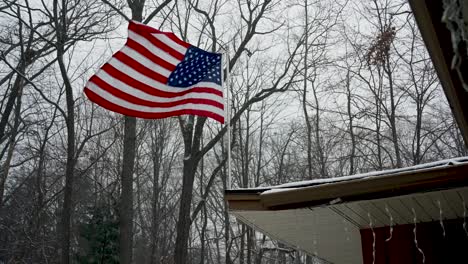 A-late-Winter-flurry-blowing-through-an-American-Flag