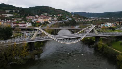 High-angle-overview-of-Millennium-Bridge-Miño-River-in-Ourense,-Galicia,-Spain