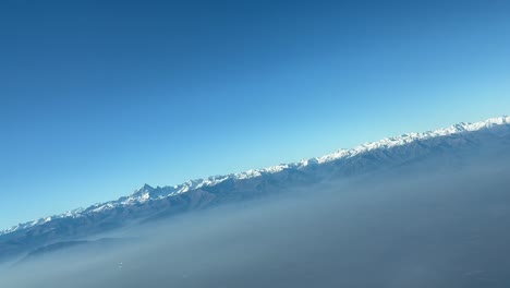 Panoramic-view-of-the-Alps-and-Matterhorn-peak-shot-from-a-jet-cabin-during-a-right-turn-departing-from-Turin-airport