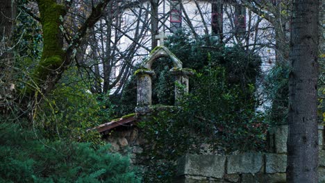 Telephoto-view-of-stone-masonry-cross-on-top-of-Hermitage-of-Portovello,-As-Lagoas-Ourense-Spain