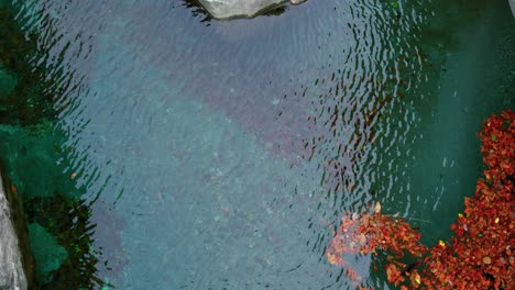 Top-view-of-the-water-ripples-around-the-rocks-in-Cavergno-village