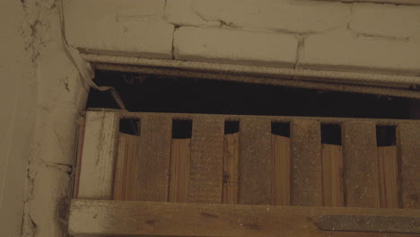 Close-up-of-wooden-rafters-in-an-old-basement