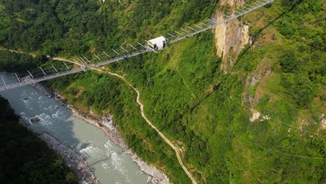 Person-hanging-from-Kushma-bungee-jump-off-suspension-bridge