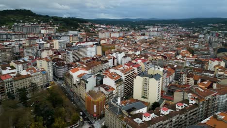 Sprawling-apartment-buildings-up-into-deep-valleys-in-Ourense-Spain,-overcast-cloudy-day
