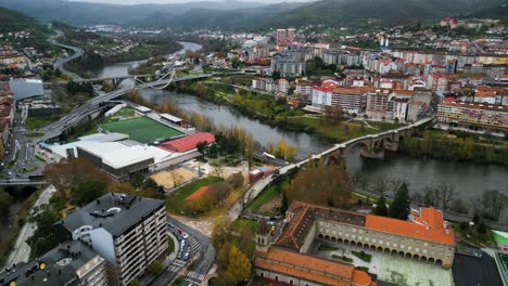 Drone-shot-of-the-Ourense-Roman-and-Millenium-bridge-crossing-Miño-River,-Ourense-Galicia-Spain