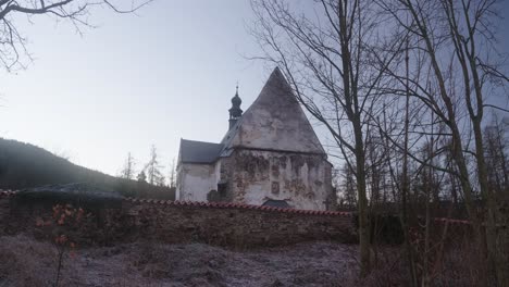 Panoramic-view-of-the-Gothic-church-in-Velhartice,-which-has-a-mysterious-face-of-a-girl-on-the-plaster