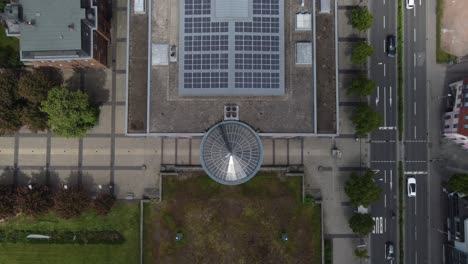 Large-Sustainable-public-building-with-solar-roof,-Aerial-top-down