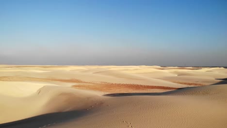 Breathtaking-aerial-shot-of-the-undulating-sand-dunes-of-the-Zahek-Desert-on-Socotra-Island,-Yemen
