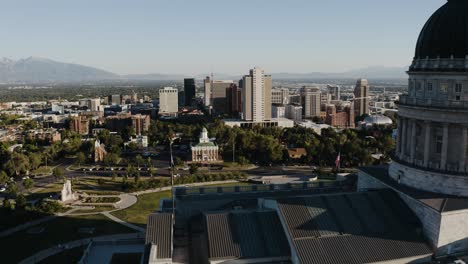 Drone-shot-showing-the-Salt-Lake-City,-Utah-capitol-building-overlooking-the-downtown-skyscrapers