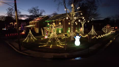 Christmas-lights-drone-slow-rise-dusk-holiday-cheer-festive