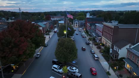 Small-town-America-square-with-American-flag-and-historic-buildings