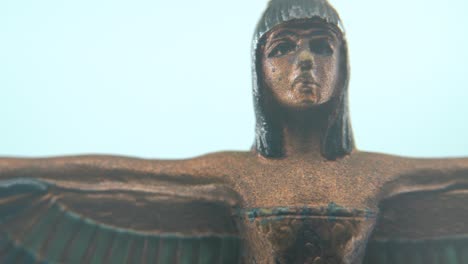 Dreamy-macro-shot-of-a-Cleopatra-statue-with-wide-open-wings,-hazy-depth-of-field,-ancient-Egypt-Queen-of-Kings,-Egyptian-historical-ruler,-antique-artwork-of-a-goddess,-smooth-4K-video-pan-right