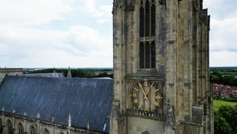Rising-shot-of-Beverley-Minster-Yorkshire-showing-magnificent-architecture,clock-and-tower-to-its-pinnacle