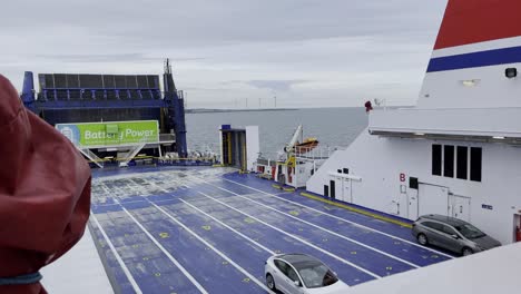 covers-a-car-ferry-on-the-sea-with-few-cars-and-water-to-the-horizon