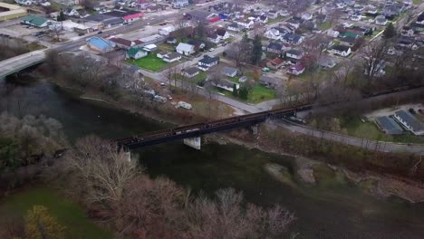 Logansport-Indiana-aerial-view-freight-train-crossing-scenic-autumn-river-bridge