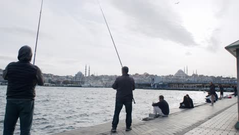 Group-of-fishermen-fishing-at-sea