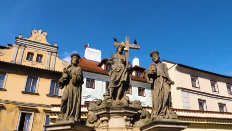 Statues-of-Saints-Cosmas-and-Damian-on-Charles-Bridge-in-Prague,-Czech-Republic