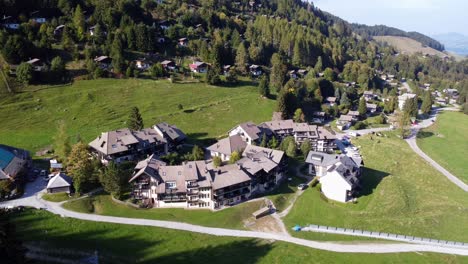 Drone-shot-of-small-village-in-Switzerland-next-to-Moleson-hill