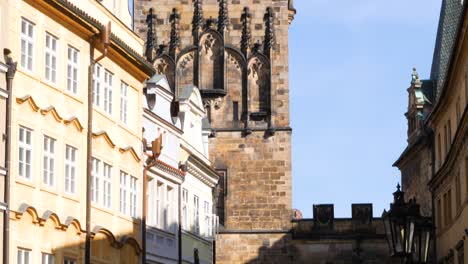 Tourists-visiting-Lesser-Town-Bridge-Tower,-Charles-Bridge,-Prague,-Czech-Republic