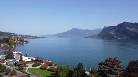 Drone-shot-of-idyllic-Hergiswill-in-Switzerland-Pan-shot-of-Lucerne-lake