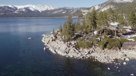 A-low-flying,-4K-drone-shot-over-Lake-Tahoe,-California,-during-the-winter-season