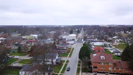 Aerial-view-flying-over-quiet-Sheridan-town-idyllic-autumn-neighbourhood-property-in-Indiana