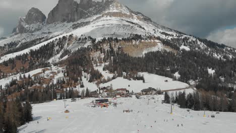 Drone-footage-of-Passo-di-Costalunga,-South-Tyrol,-featuring-the-Dolomites---Roda-di-Vael