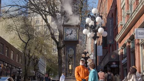 Gastown,-Vancouver,-Canada---Two-Individuals-Positioned-Near-the-Steam-Clock---Medium-Shot