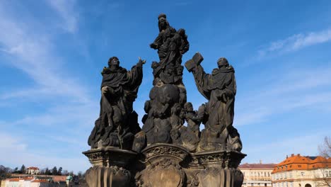 Statues-of-Madonna,-Saint-Dominic-and-Thomas-Aquinas-on-Charles-Bridge-in-Prague,-Czech-Republic