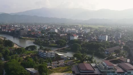 Aerial-View-Of-Morning-Sunrise-Misty-Air-Over-Vang-Vieng-In-Laos
