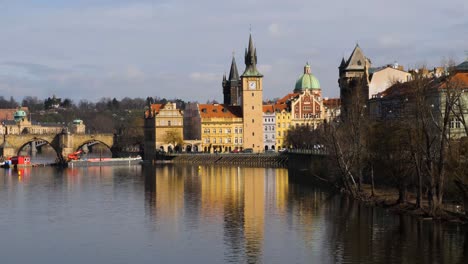 Vltava-River,-Old-Town-Waterworks-Tower-and-Charles-Bridge-in-Prague,-Czech-Republic