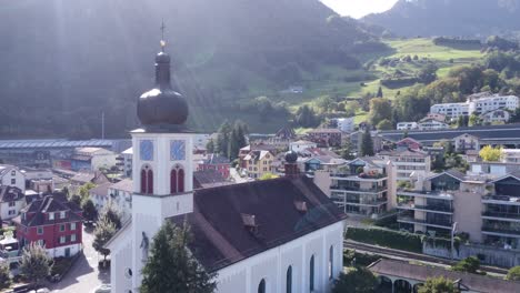 Drone-shot-church-in-small-village-idyllic-Hergiswill-in-Switzerland