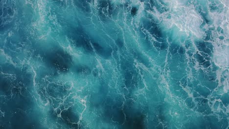 Aerial-view-of-waves-crashing-in-the-sea