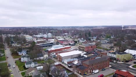 Aerial-view-with-birds-flying-across-Sheridan-town-autumnal-midtown-neighbourhood-in-Hamilton-county-Indiana