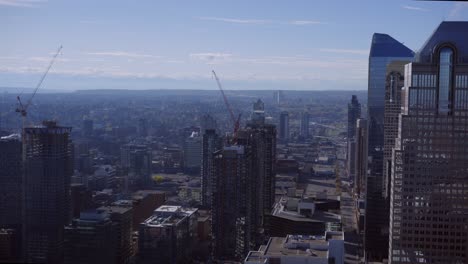 Calgary-skyscraper-cranes-downtown-street-static