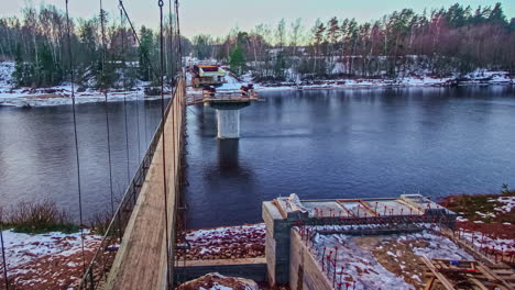 Time-lapse-of-steel-beams-being-installed-as-the-base-of-a-bridge-in-Latvia's-Gauja-National-Park