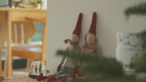 Festive-fabric-Scandinavian-elves-in-traditional-holiday-attire-on-display