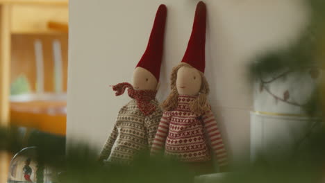 Festive-fabric-Scandinavian-elves-in-traditional-holiday-attire-on-display