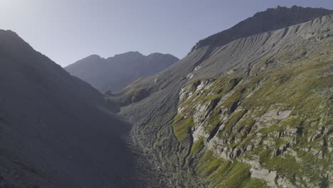 Drone-captures-distant-Edelrauthütte-or-Rifugio-Passo-Ponte-di-Ghiaccio-at-sunset-in-the-Zillertal-Alps-of-South-Tyrol